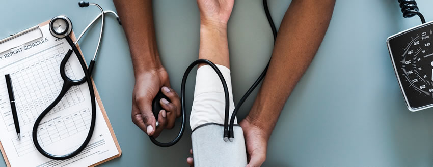 image of blood pressure being taken, representing health services